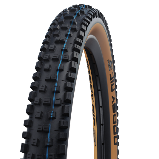 SCHWALBE NOBBY NIC 27.5x2.40 ADDIX SPEEDGRIP SUPERGROUND Snakeskin Tubeless Ready Soft Black/Brown tire